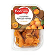 Packaged sundried apricot halves with Bodrum brand label on a wooden background