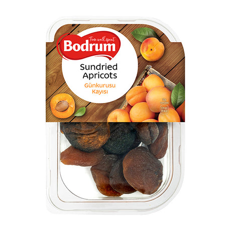 Packaged sundried apricots with Bodrum brand label on a wooden background