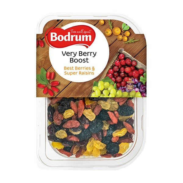 Bodrum Very Berry Boost package with dried berries on a wooden background