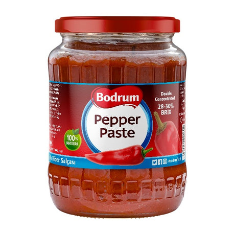 Jar of Bodrum Pepper Paste with a red lid on a white background