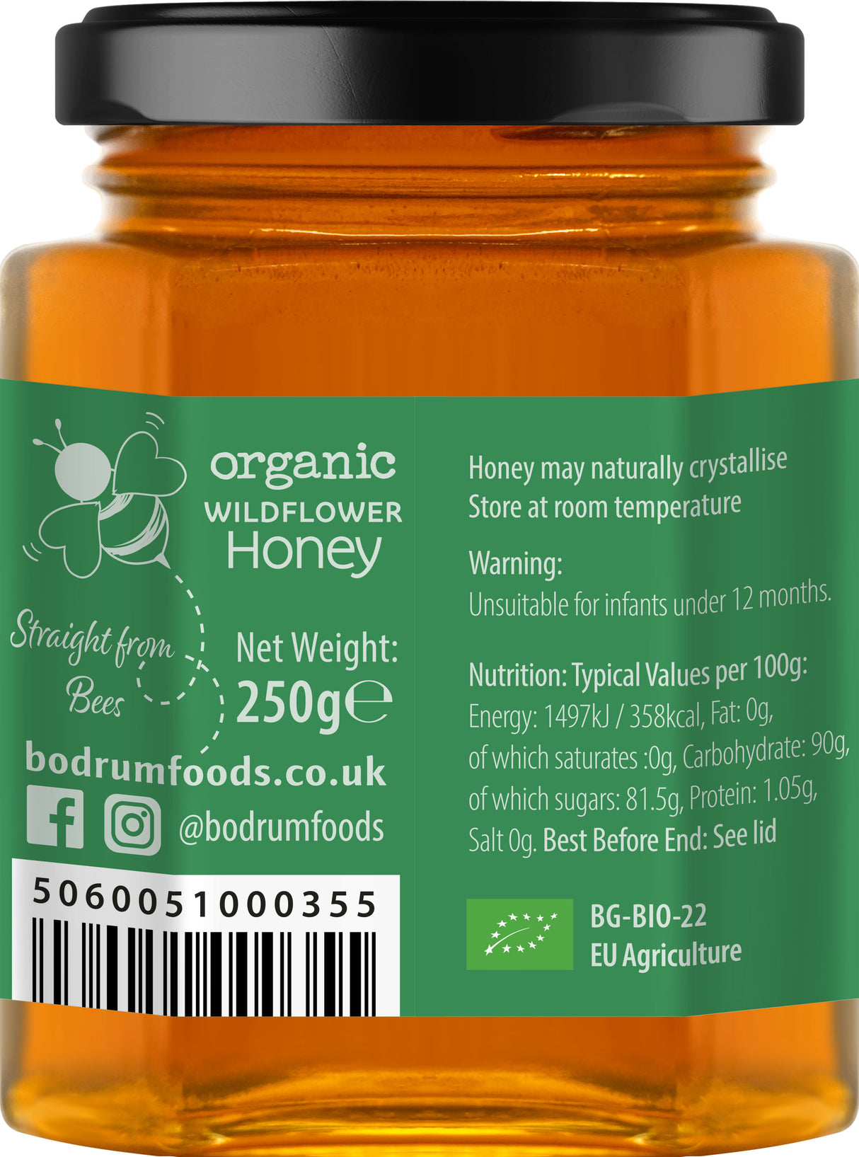 Jar of organic wildflower honey with label showing branding and product details.