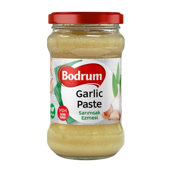 Jar of Bodrum Garlic Paste with a red lid on a white background