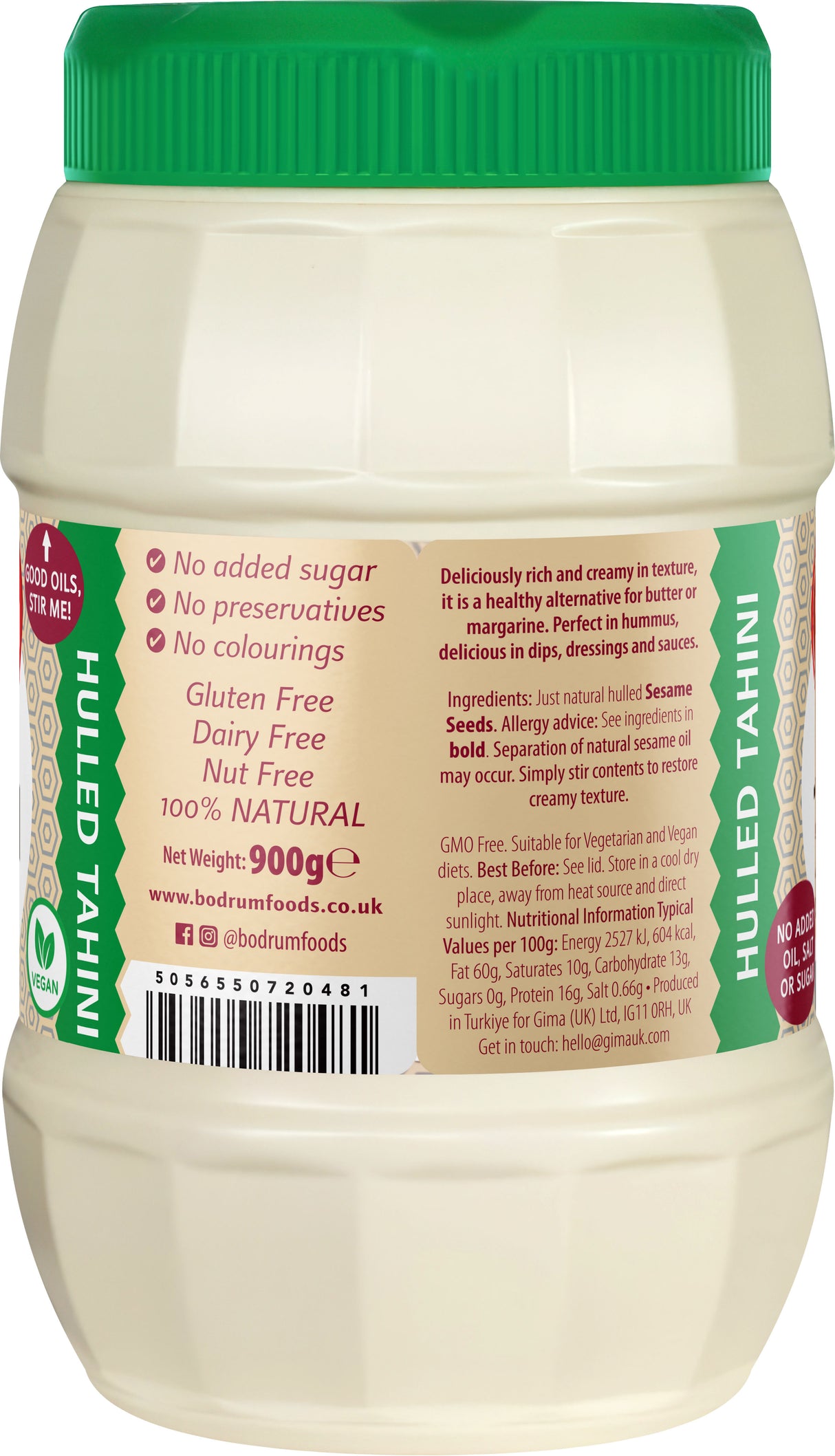 Jar of hulled tahini with green lid and label