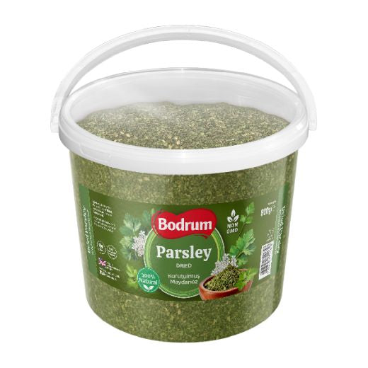 Bucket of dried parsley with Bodrum brand label on a white background