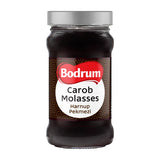 Jar of Bodrum Carob Molasses on a white background