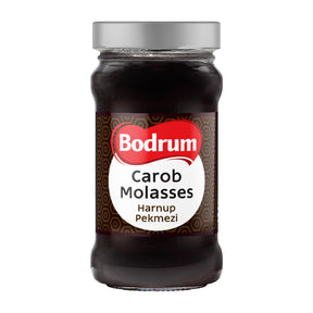 Jar of Bodrum Carob Molasses on a white background
