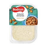 Packaging of Bodrum ground almonds with a bowl of almonds on a white background
