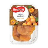 Packaged dried apricots with Bodrum brand label on a wooden background