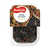 Packaged dried currants with Bodrum brand label on a wooden background