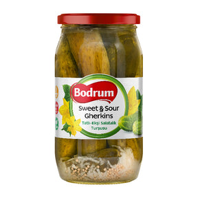 Jar of Bodrum Sweet & Sour Gherkins with a red lid on a white background