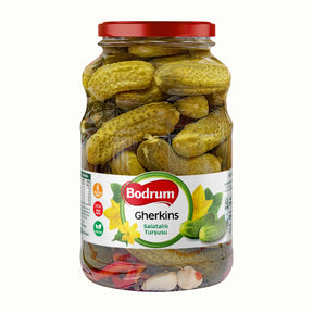 Jar of Bodrum gherkins with a red lid on a white background