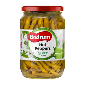 Jar of Bodrum hot peppers with a red lid on a white background