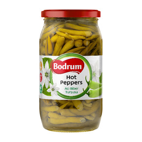 Jar of Bodrum hot peppers with a red lid on a white background
