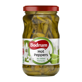 Jar of Bodrum hot peppers with a red lid on a white background