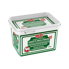 Bucket of sheep's milk cheese with green and white label on a white background