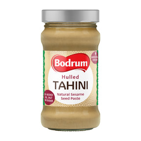 Jar of Bodrum hulled tahini on a white background