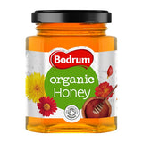 Honey jar with label showing brand information and product details