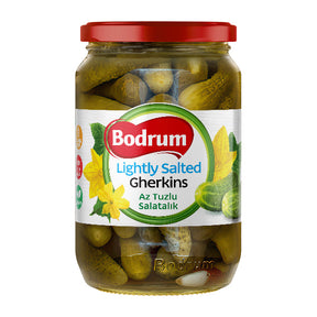Jar of Bodrum lightly salted gherkins with a red lid on a white background