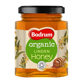 Jar of Bodrum organic linden honey on a white background