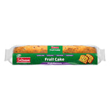 Packaged fruit cake with green label on a white background