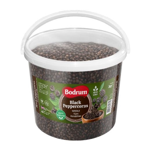 Bucket of Bodrum Black Peppercorns on a white background